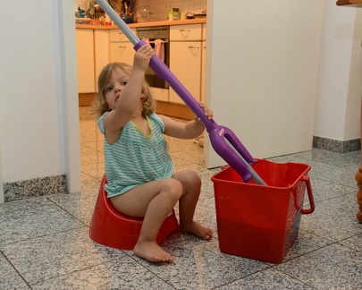 Greta mopping while on the potty